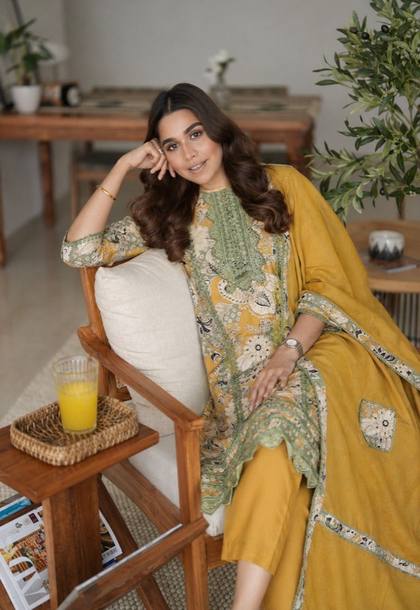 A mustard kurta set with a printed dupatta